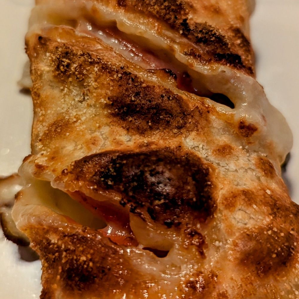 Pinthouse Pizza - Close up of the Pizza Roll - Pizza Near Me - Austin, Texas Pinthouse Pizza - Close up of the Pizza Roll - Pizza Near Me - Austin, Texas