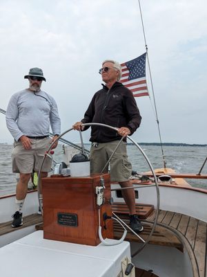 Photo of Schooner Woodwind - Annapolis, MD, US. Hubby steering