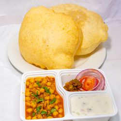 Made in India Restaurant - Chana Bhatura served with side of chana and Raita .