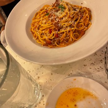 Bravo! Italian Kitchen - a plate of spaghetti and a glass of water - Italian Near Me - West Des Moines, Iowa Bravo! Italian Kitchen - a plate of spaghetti and a glass of water - Italian Near Me - West Des Moines, Iowa