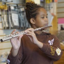 Melody Mart - Student trying a flute at Open House 2024!