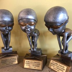 Swimming Stages Swim Academy - Trophies earned by our beginner swimmers!