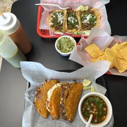 Carne asada and quesabirria tacos, chips & guacamole