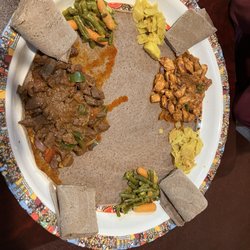 Awash Ethiopian Cuisine - B4. Beef Tibs and chicken tibs , missed the mark this time with cold injera and lukewarm meat. The beef was also very chewy and overcooked