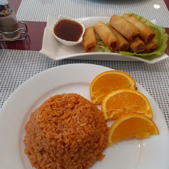 Barrio Cusina - a plate of rice and orange slices - African Near Me - Sedgewick, Alberta Barrio Cusina - a plate of rice and orange slices - African Near Me - Sedgewick, Alberta