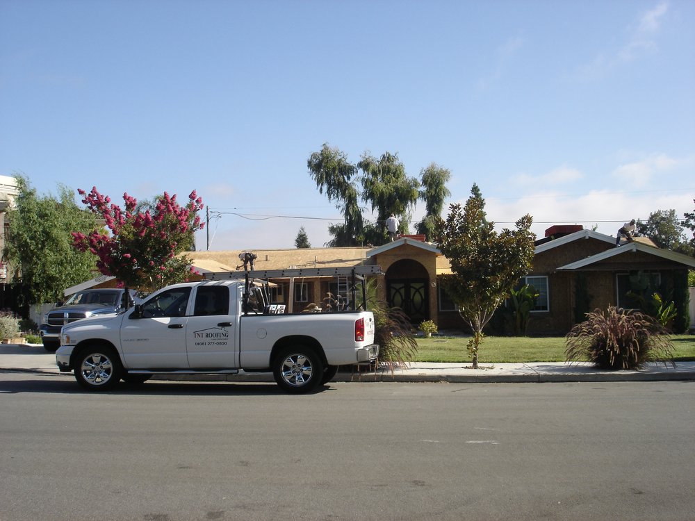 Slide of TNT Roofing