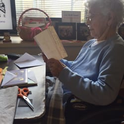 Lewis Memorial Christian Village - Grandma in her room reading the mail she receives from the front desk