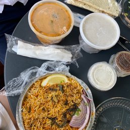 61. Chicken Biryani (rice dish) 21. Chicken Tikka Masala (covered orange container) - contains cashew