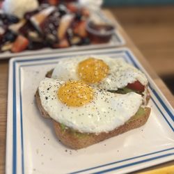 Biscuit Belly - Huntsville - Avocado toast with sunny side up.