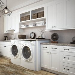 Kits Kitchen Bath & Floors - Beautiful laundry area with white shaker cabinets on vinyl floors
