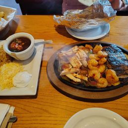 Fajitas with chicken, shrimp, and steak.