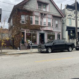 Front street view of the coffee shop (light pink building) Front street view of the coffee shop (light pink building)