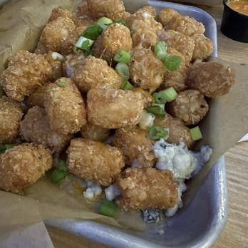Buffalo Wild Wings - Large tots... custom, blue cheese Colby Jack and green onion.... Delicious. - Chicken Wings Near Me - Boynton Beach, Florida