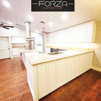 Forza Contractors - a kitchen with white cabinets and wood floors - Electricians Near Me - Orlando , Florida Forza Contractors - a kitchen with white cabinets and wood floors - Electricians Near Me - Orlando , Florida