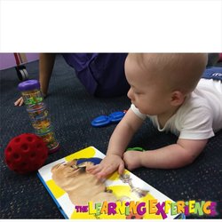 The Learning Experience - Hoboken - Even our young Infants enjoy reading books. Look at that big dog!