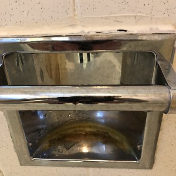 Gray Wolf Lodge - Rusted soap dish in shower - Hotels Near Me - Manistique, Michigan Gray Wolf Lodge - Rusted soap dish in shower - Hotels Near Me - Manistique, Michigan