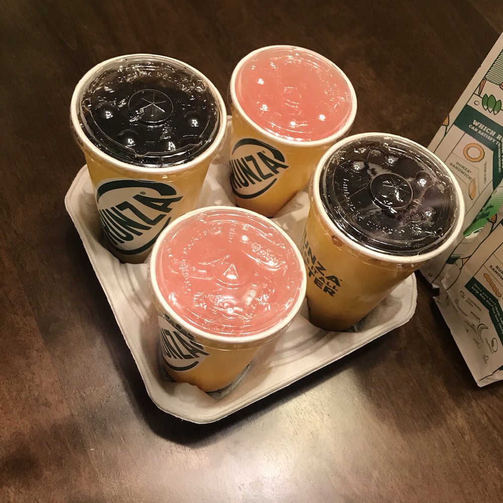 Runza - four cups of drink on a tray - New American Near Me - Lawrence, Kansas Runza - four cups of drink on a tray - New American Near Me - Lawrence, Kansas
