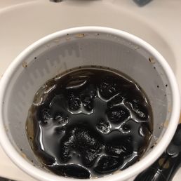 a bowl of black liquid in a sink a bowl of black liquid in a sink