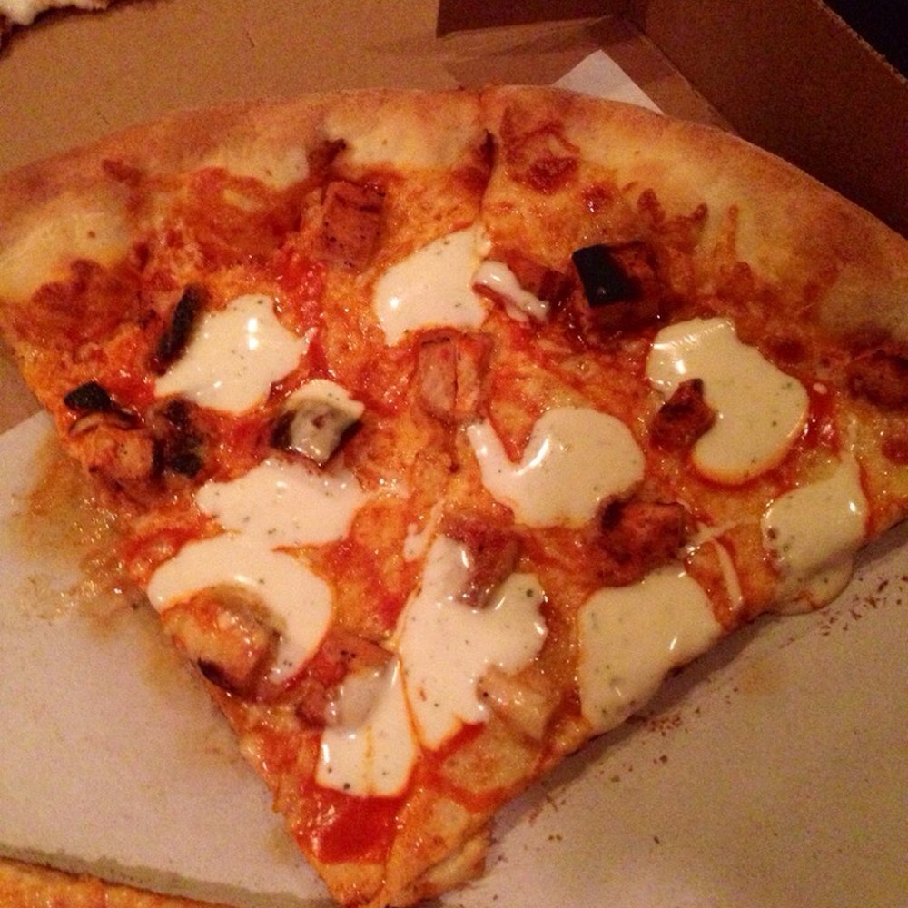 Burnt chicken on buffalo chicken pizza. And really skimpy on the meat. Burnt chicken on buffalo chicken pizza. And really skimpy on the meat.