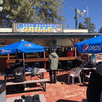 Deer Meadow Grill - people sitting at tables under blue umbrellas - American Near Me - Running Springs, California Deer Meadow Grill - people sitting at tables under blue umbrellas - American Near Me - Running Springs, California