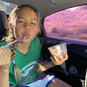 Bowl'd Bites - a little girl in a car - Acai Bowls Near Me