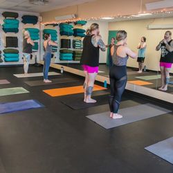 Praxis Yoga - Students participating in beginning deep breathing