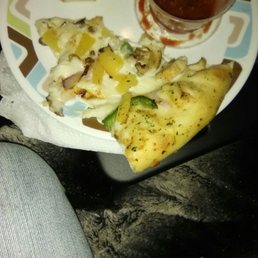 a plate of pizza and a drink