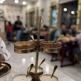 This is their legendary chutney stand which is served on each table no matter what they order This is their legendary chutney stand which is served on each table no matter what they order