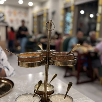 Simply South - This is their legendary chutney stand which is served on each table no matter what they order - Indian Near Me - Frisco, Texas Simply South - This is their legendary chutney stand which is served on each table no matter what they order - Indian Near Me - Frisco, Texas