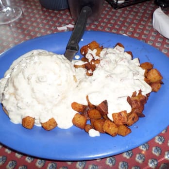 Over Easy Cafe - Biscuits and gravy with country potatoes - Breakfast & Brunch Near Me - Sanibel, Florida