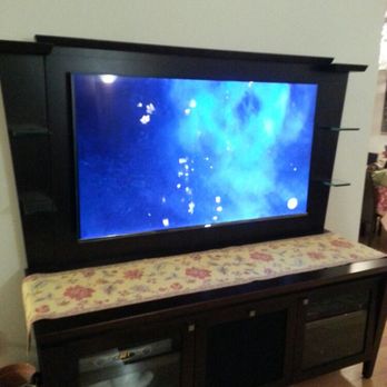 Oliver Home Technologies - Mounted tv on entertainment center - Home Theatre Installation Near Me Oliver Home Technologies - Mounted tv on entertainment center - Home Theatre Installation Near Me