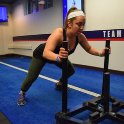 F45 Training State College - Sled Pushes on the Track