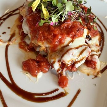Palm Grill - Chicken Parmesan and roasted vegetable stack wit marinara sauce. - New American Near Me - Fort Myers, Florida Palm Grill - Chicken Parmesan and roasted vegetable stack wit marinara sauce. - New American Near Me - Fort Myers, Florida