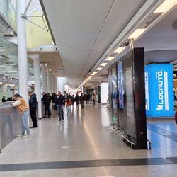 Aeroporto di Catania - Baggage claim at the left is thankfully exit only, shops and services are at the right, but this shoehorned passage in arrivals annoys me