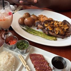 Steak and mashed potatoes with asparagus and mushrooms, and ahi tuna steak meal
