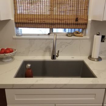 Prime Granite And Cabinets - Quartz kitchen counter with new cabinetry, sink and windowsill. - Countertop Installation Near Me - Atwater, California Prime Granite And Cabinets - Quartz kitchen counter with new cabinetry, sink and windowsill. - Countertop Installation Near Me - Atwater, California