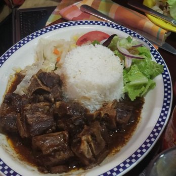 The Islands - Oxtail with jasmine rice and salad - Caribbean Near Me - Brooklyn, New York The Islands - Oxtail with jasmine rice and salad - Caribbean Near Me - Brooklyn, New York
