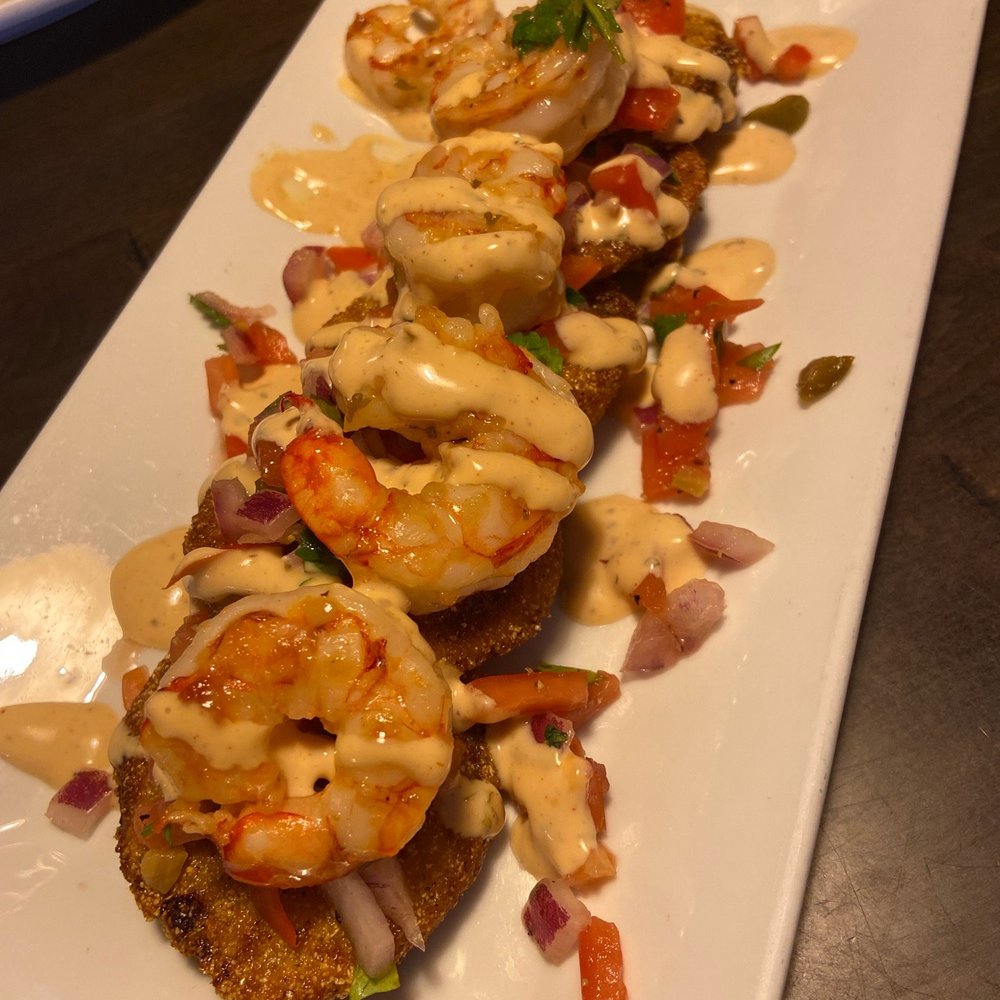 Fried green tomatoes topped with shrimp