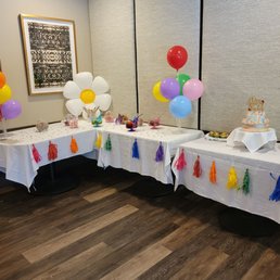 a table with balloons and tassels a table with balloons and tassels