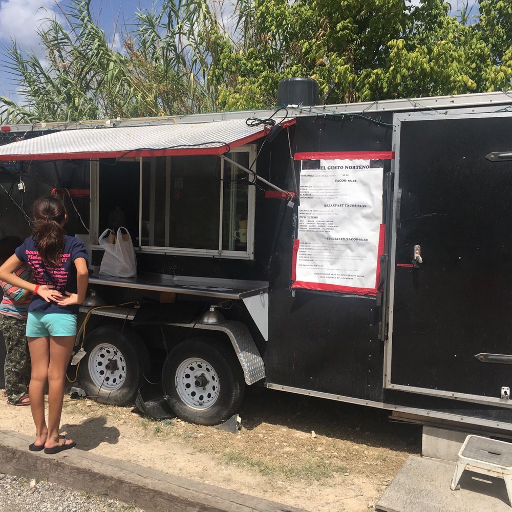 El Gusto Norteno - a woman standing in front of a food truck - Food Trucks Near Me - Lockhart, Texas El Gusto Norteno - a woman standing in front of a food truck - Food Trucks Near Me - Lockhart, Texas