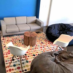 Brewery District Work Co - Lounge space with whiteboard, couch and beanbags