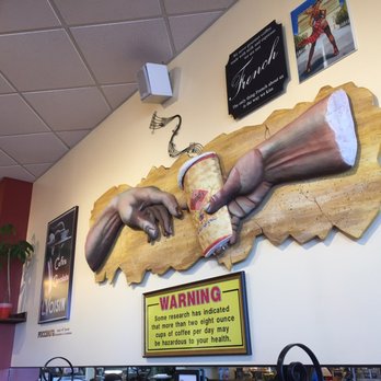 Puccino's Coffee - I like the nod to the Creation of Adam. Check out that warning sign, though. - Coffee & Tea Near Me - Metairie, Louisiana Puccino's Coffee - I like the nod to the Creation of Adam. Check out that warning sign, though. - Coffee & Tea Near Me - Metairie, Louisiana