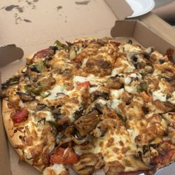 Brennivins Pizza Hus - greek with all the fixings (veggie ) mushrooms, tomatoes, feta, olives, onions, greek dressing, cucumbers and mozzarella
