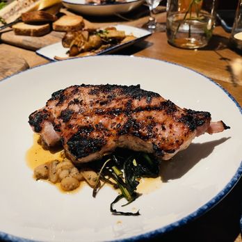 Sylvan Table - Pork chop - New American Near Me - Sylvan Lake, Michigan Sylvan Table - Pork chop - New American Near Me - Sylvan Lake, Michigan