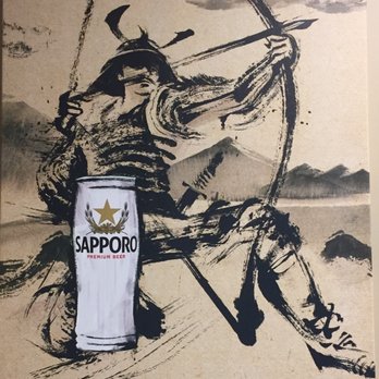 Sleeman - a picture of a man with a bow and arrow and a can of sapporo - Breweries Near Me - Guelph, Ontario