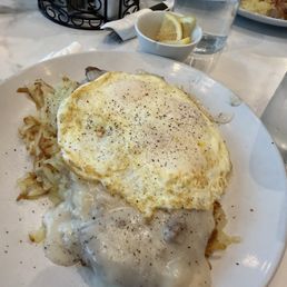 Hash browns with over easy eggs and sausage gravy