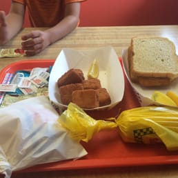 My fish sandwich and fish nuggets with fries and corn on the cob.