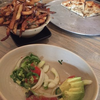 Monkeypod Kitchen - Avocado & Cucumber salad, Garlic Truffle Oil Fries, Hamakua Wild Mushroom & Truffle Oil pizza - New American Near Me - Lahaina, Hawaii