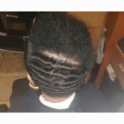 Natural curly hair straightened and curled with marcel iron