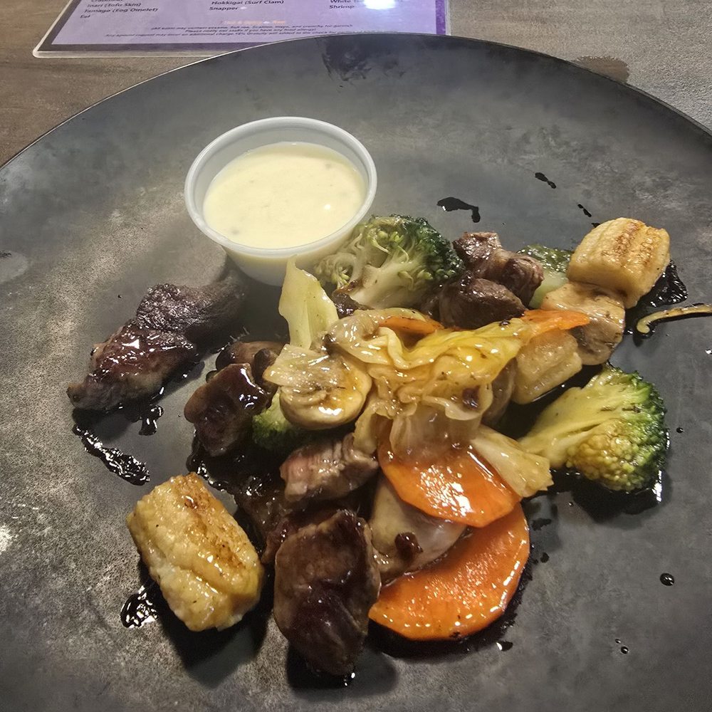 Steak "hibachi" (that was smothered in teriyaki sauce) with some gross dipping sauce Steak "hibachi" (that was smothered in teriyaki sauce) with some gross dipping sauce